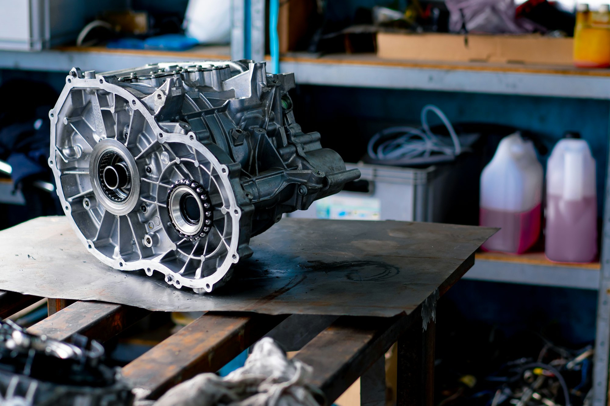 Close-up of parts of a clean engine block removed from a car for repair which lie on a table